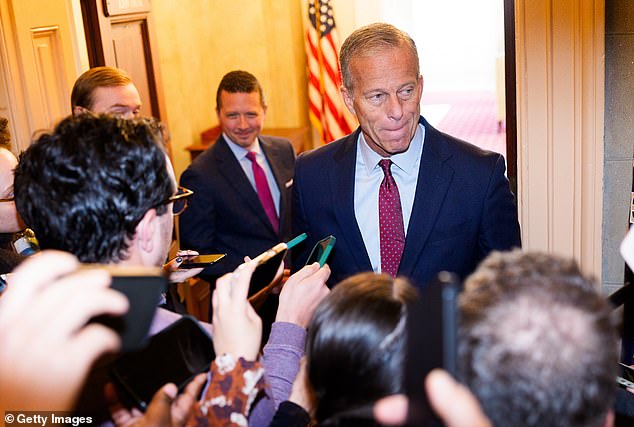 Senate Majority Leader John Thune (R-SD) speaks to members of the press as he heads to his office in the Capitol Building on November 8, 2025 in Washington, DC