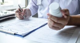 doctor holding pills