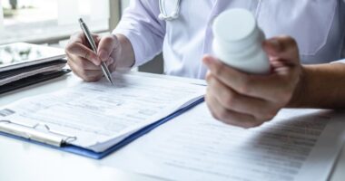 doctor holding pills