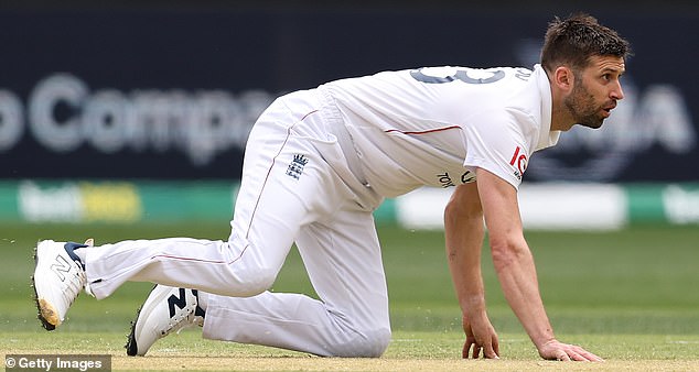 PERTH, AUSTRALIA - NOVEMBER 22: Mark Wood of England falls over after a delivery during day two of the First 2025/26 Ashes Series Test Match between Australia and England at Perth Stadium on November 22, 2025 in Perth, Australia. (Photo by Cameron Spencer/Getty Images)