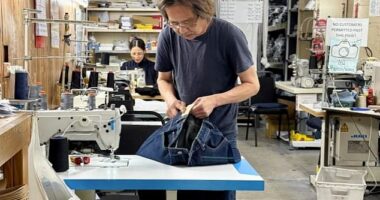 Vietnamese tailor Nam Huynh (pictured) has been running his family business Dejour Jeans at his Brunswick East shop in Melbourne for more than three decades