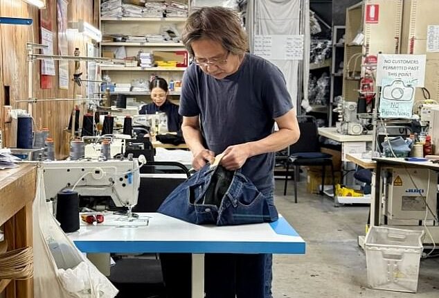 Vietnamese tailor Nam Huynh (pictured) has been running his family business Dejour Jeans at his Brunswick East shop in Melbourne for more than three decades