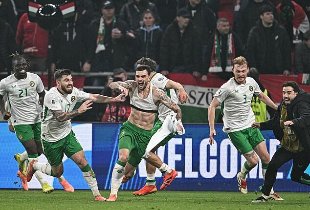Troy Parrott hit a stunning hat-trick to help Ireland secure a World Cup play-off place in a dramatic qualifier at the Puskas Arena