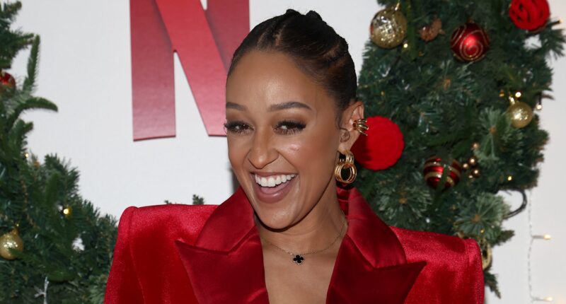 Tia Mowry Sparks Questions Mystery Man Hand Appears In Selfie Photo Cory Hardrict