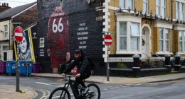 ‘I’m just a normal lad from Liverpool whose dream has just come true,’ reads some white graffiti on a blacked-out background next to a big illustration of Trent Alexander-Arnold on Sybil Road