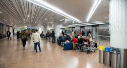 Brussels Airport is closed after the reported sighting of a drone, said the Belgian air traffic control service and a spokeswoman for the airport. Pictured: Travellers wait in an empty departure hall at Zaventem airport as air traffic is suspended following a reported drone sighting, in Zaventem outside Brussels, on November 4, 2025