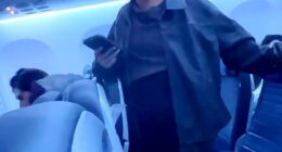 A blonde woman was seen repeatedly shouting a vulgar slur at airline crew members and passengers while on board a United Airlines flight on November 9 in Newark, New Jersey