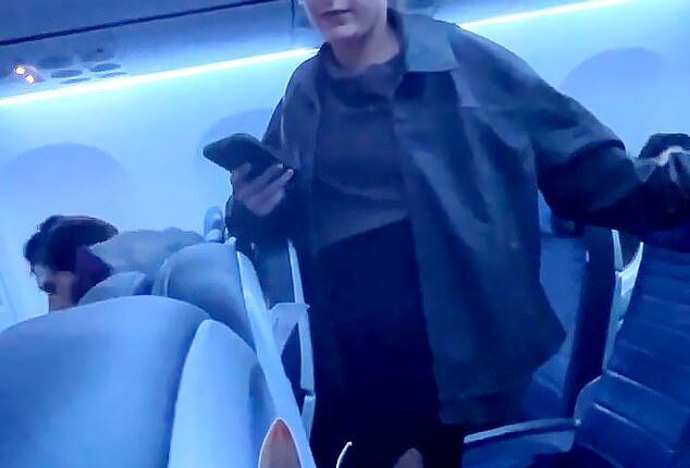 A blonde woman was seen repeatedly shouting a vulgar slur at airline crew members and passengers while on board a United Airlines flight on November 9 in Newark, New Jersey