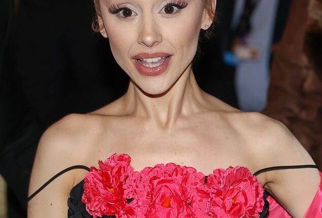 Ariana Grande showed off her 40 hand 'prison' tattoos as she stepped out for the premiere of Wicked: For Good in Paris