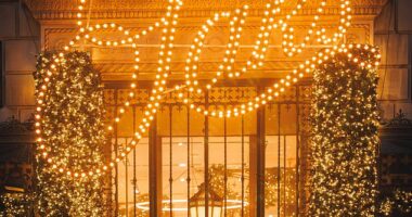 Christmas lights glow outside the flagship Saks Fifth Avenue store in New York, a holiday tradition that has drawn crowds for decades.