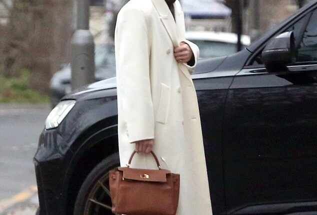 Holly Ramsay, 25, stunned in a white coat as she headed to Bath with her family ahead of her wedding to Adam Peaty amid his family feud