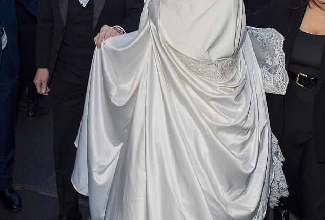 Holly Ramsey stuns as she arrives in a white gown with her father Gordon Ramsay ahead of her wedding