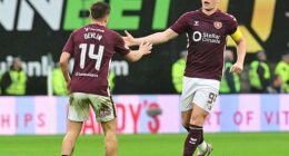 Cammy Devlin celebrates with Lawrence Shankland after pulling another goal back for Hearts
