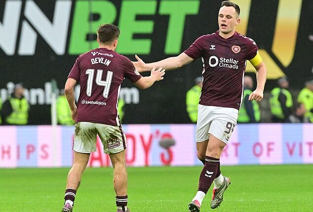 Cammy Devlin celebrates with Lawrence Shankland after pulling another goal back for Hearts