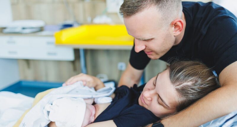 Mom, Dad, and baby after mom gave birth