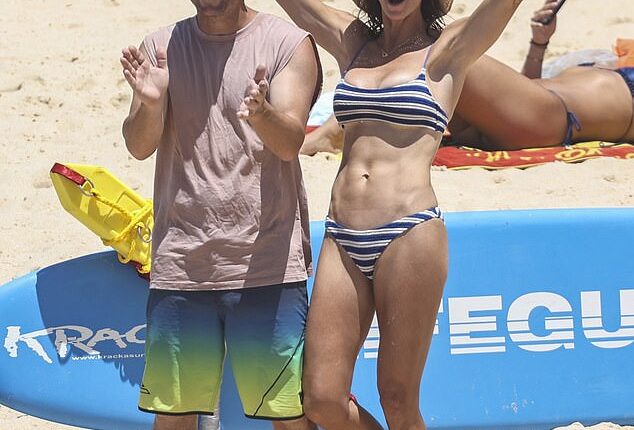 Candice Warner looked every inch the beachside bombshell as she rang in Christmas Eve with her husband David and their three daughters at Sydney's Maroubra Beach on Wednesday