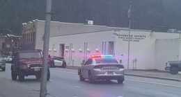 Pictured: There is a heavy police presence outside the Shoshone County Sheriff’s Office in Wallace, Idaho. Authorities have confirmed there is an active shooter situation