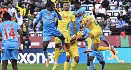 The ball flies over Benin defender Olivier Verdon's head before it appears to land on Democratic Republic of Congo captain Chancel Mbemba's arm late on in the match