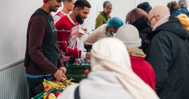 Douglas Luiz (centre) helps out at the Salaam Shalom Kitchen in Nottingham that provides free hot meals to those in need every Wednesday. ‘It’s a special day,' he says, 'because sometimes you need to see real life'
