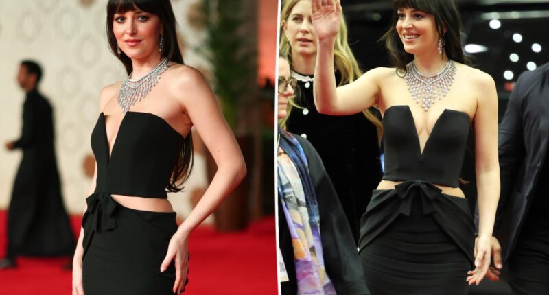 Dakota Johnson wears black Alessandra Rich dress with pelvis cutouts to 2025 Red Sea International Film Festival