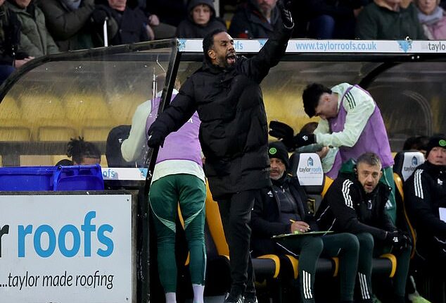 Nancy tries to cajole his players from the touchline amid the chaos of the Livingston game