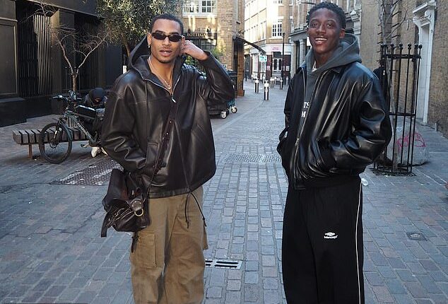 Kobbie Mainoo's brother, Jordan (left), made sure to show his discontent at his sibling's treatment at Manchester United on Monday