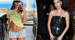 Hailey Bieber displays taut midriff in tiny polka-dot shorts for beachside selfie