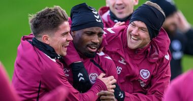 Cammy Devlin, Elton Kabangu and Blair Spittal share a joke in Hearts training