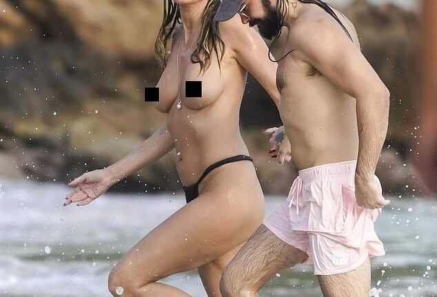 Heidi Klum brought the holiday heat as she went topless for a day in paradise on Friday