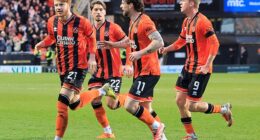 Luca Stephenson of Dundee United (left) celebrates scoring the opening goal against Hibs