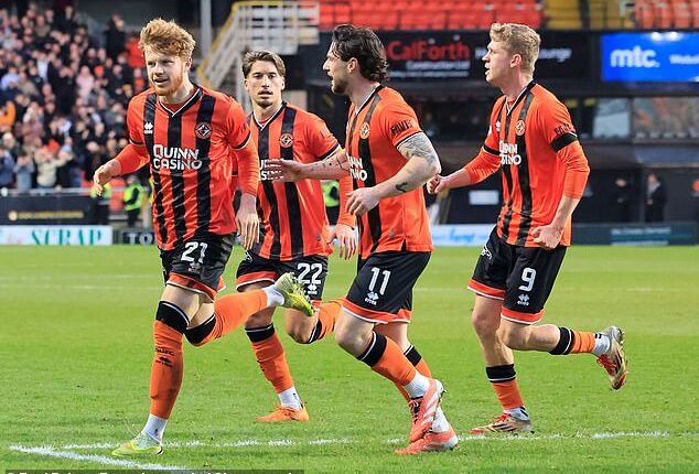 Luca Stephenson of Dundee United (left) celebrates scoring the opening goal against Hibs