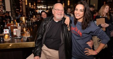 Mila Kunis, Jim Beam¿s global brand partner, and Fred Noe, the brand¿s seventh-generation master distiller, toast fans at a Repeal Day event in Chicago in December 2018.