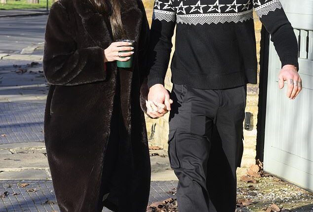 Holly Ramsay and Adam Peaty held hands as they joined her family on a Christmas morning walk - as his estranged mother and father stepped out alone two days before their big A-list wedding