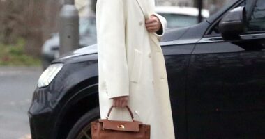 Holly Ramsay, 25, stunned in a white coat as she headed to Bath with her family ahead of her wedding to Adam Peaty amid his family feud