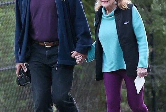 A Hollywood golden couple with an 18 year age-gap looked as smitten as can be during a leisurely stroll