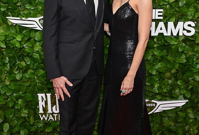 Hugh Jackman and girlfriend Sutton Foster didn't let the spotlight stop them from showing off their affection for one another