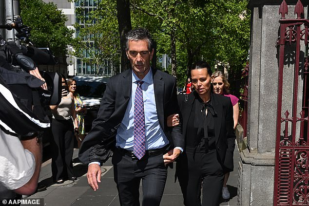 Jo Silvagni and her husband Stephen moments after Jo berated Sky reporter Georgie Dickerson (pictured in pink behind Jo)