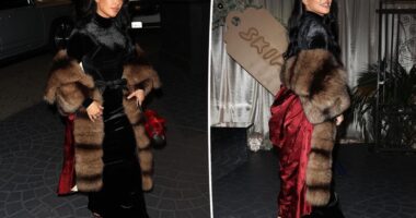 Kim Kardashian wears a black velvet dress with bow for Skims holiday party