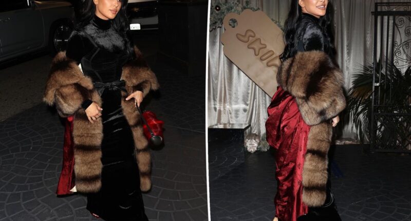 Kim Kardashian wears a black velvet dress with bow for Skims holiday party