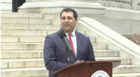 Wisconsin Attorney General Josh Kaul holds a press conference on the state capitol steps.
