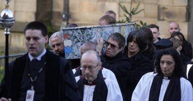 Gary 'Mani' Mounfield's coffin was carried out today by pallbearers including former Stone Rosees bandmates Alan 'Reni' Wren (left) and John Squire (right) plus Liam Gallagher (centre)