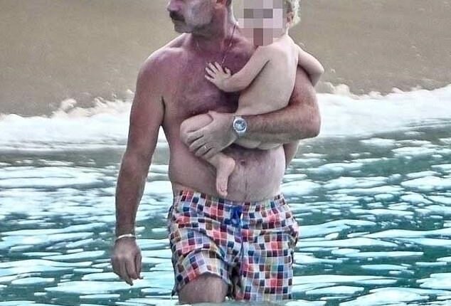 Liev Schreiber appeared relaxed and rejuvenated as held his daughter Hazel in Barbados