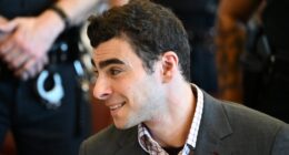 Luigi Mangione appeared upbeat as he arrived back in court on Monday, days before the anniversary of his alleged assassination of healthcare CEO Brian Thompson