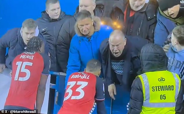 One man, wearing a black jacket, appeared particularly incensed as he leaned over the pitchside barrier, shouting at the players and gesticulating angrily