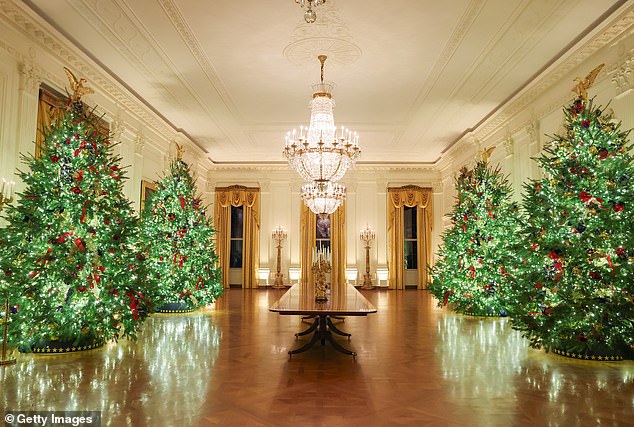 Melania Trump's Christmas decorations are seen in the East Room during an advance tour of the 2025 White House Christmas decorations on December 01, 2025 in Washington, DC. This photo was the second option presented to poll respondents