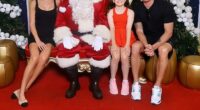 Michael Clarke has raised eyebrows after he appeared to make a cheeky comment while posing for a festive family photo with daughter Kelsey Lee and girlfriend Arabella Sherborne at a local Westfield shopping centre