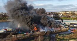 A fire that caused a huge explosion caused plumes of thick black smoke to billow over Methil Harbour in Scotland