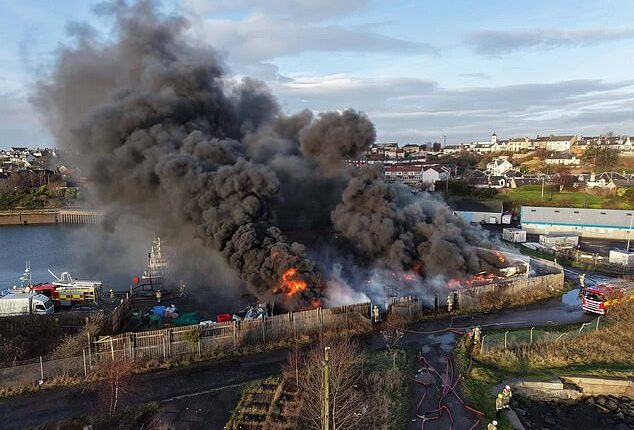 A fire that caused a huge explosion caused plumes of thick black smoke to billow over Methil Harbour in Scotland