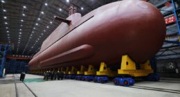 North Korea unveils apparent progress on nuclear-powered submarine as Kim slams South Korea