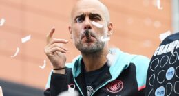 Pep Guardiola on the open-top bus parade to celebrate City's Premier League title in May 2024